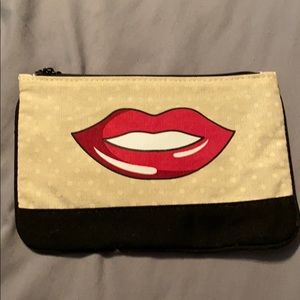 Tan and black makeup bag